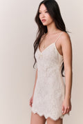 Ivory lace mini dress with spaghetti straps and scalloped lace hemline