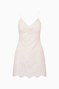 Ivory lace mini dress with spaghetti straps, V neckline, and scalloped hem