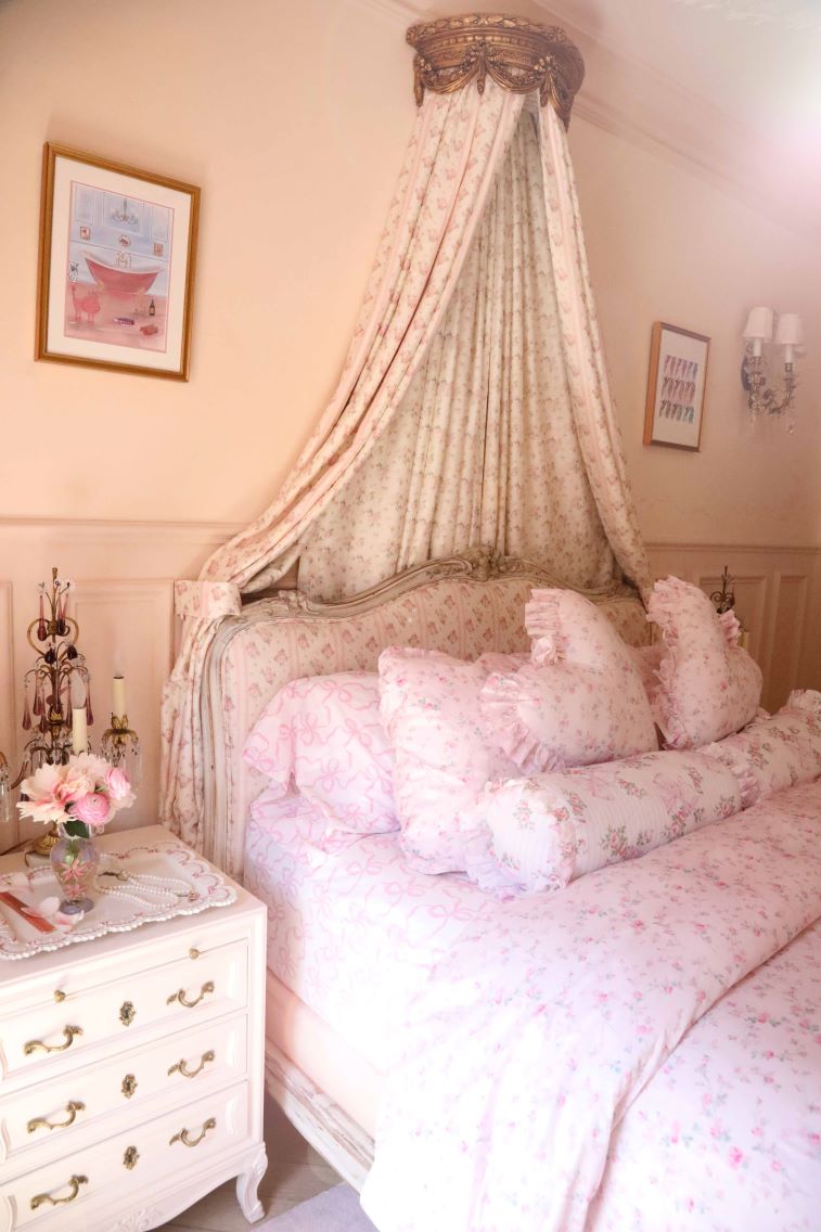 Pink printed cotton sheet set on a bed with matching pillows