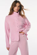 Pink wool-cashmere turtleneck sweater with cable knit front and ribbed hem