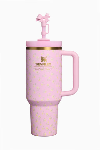 Pink Stanley Quencher tumbler with straw spout, handle, gold rim and floral pattern