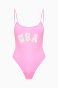 Pink one-piece swimsuit with USA graphic, front view, thin spaghetti straps