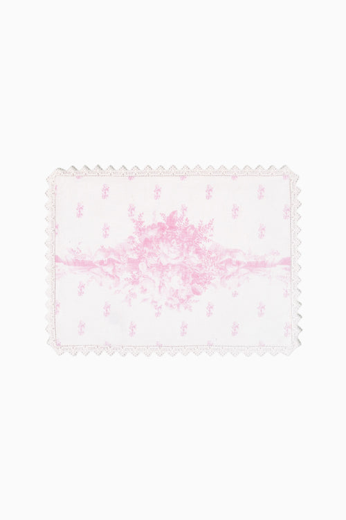 Pink floral place mat with scalloped lace edge and Victorian-style pattern