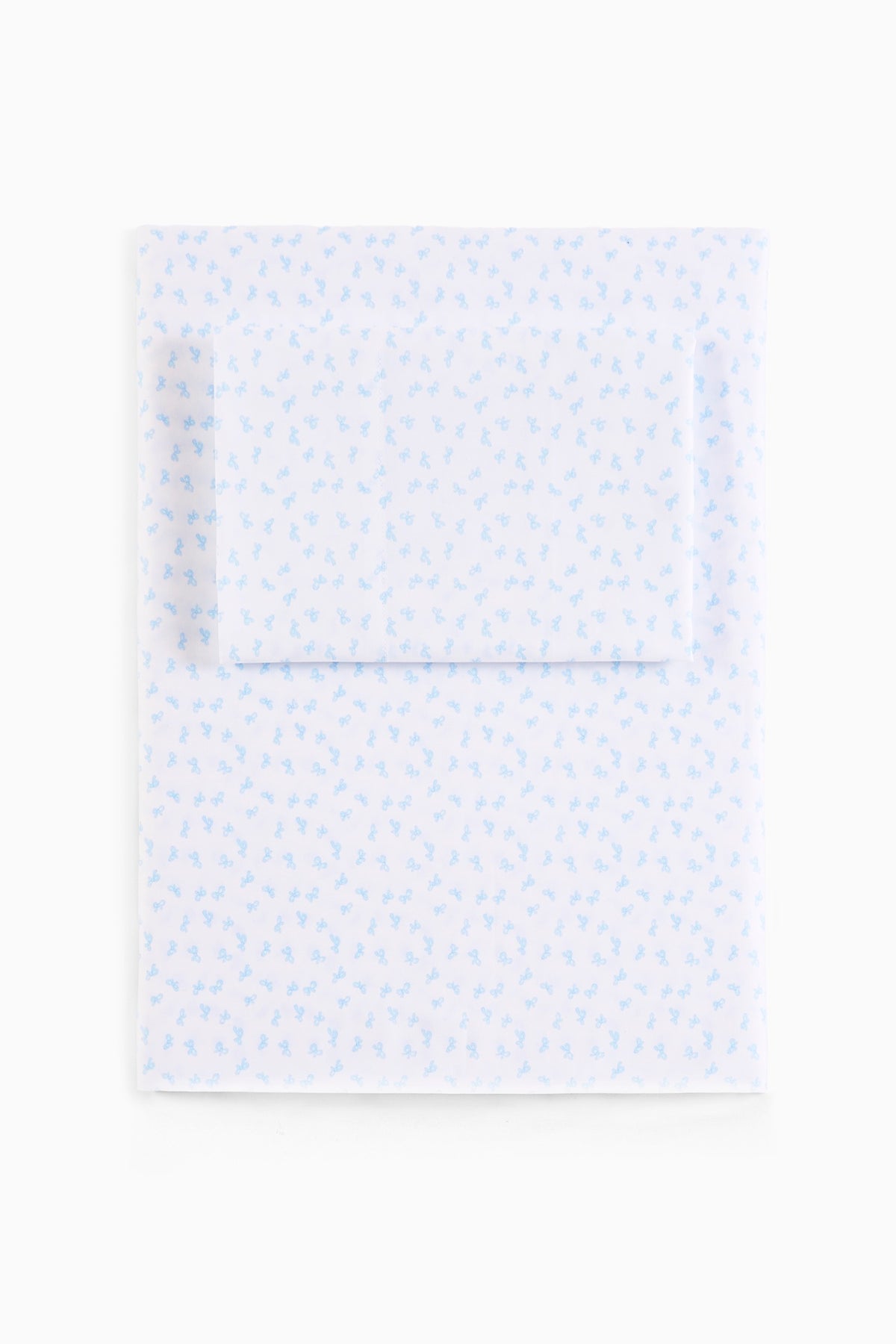 Printed cotton sheet set with small light-blue all-over pattern, flat view