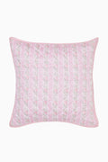 Quilted pink-and-white floral pillow with squared corners