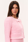 Pink tweed jacket with pearl-trimmed shoulder seam and chest flap pocket