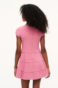 Pink pointelle knit tiered mini dress with cap sleeves and layered skirt from back