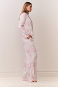 Ivory wide-leg pants with pink toile bandana print, side view