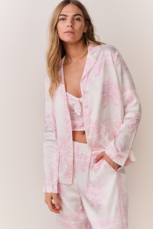 Ivory button-front shirt with pink bandana toile print, open collar, long sleeves
