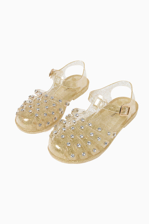 Champagne rhinestone jelly sandals with ankle strap and buckle