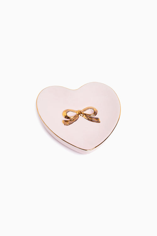 Heart-shaped ring dish in PROPER PINK with gold bow detail