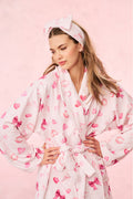 Pink patterned bow headband with fabric knot front, elastic back