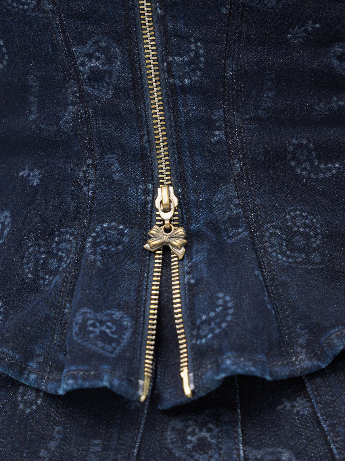 Dark blue denim bustier front with gold-tone zipper and flared peplum hem