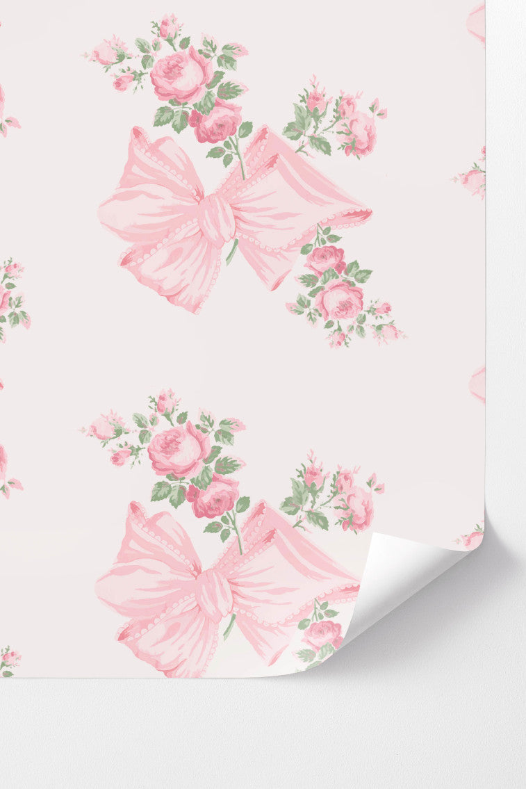 Peel-and-stick wallpaper with pink floral bows and rose bouquets on light background