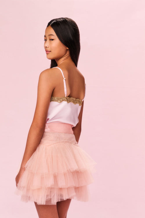 Back view of tiered tulle skirt in pale pink with ribbon waistband bow