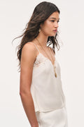 Alabaster crepe lace cami with spaghetti straps and scalloped lace neckline.