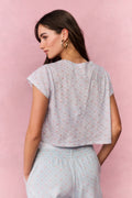 Light gray cropped tee with small scatter print, back view and short sleeves