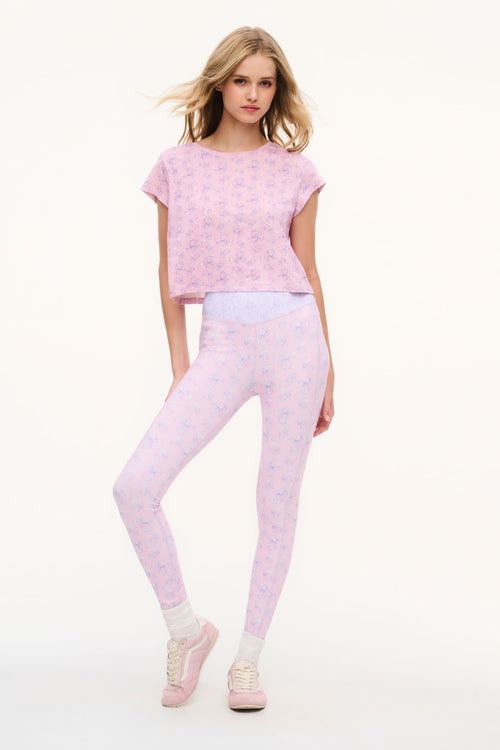 Light mauve mixed-print leggings with elastic waistband, full-length, standing pose