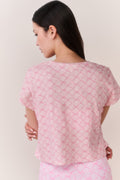 Pink cropped tee with lattice texture, short sleeves, and back view
