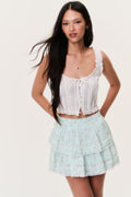 Celadon floral ruffle mini skirt with tiered, gathered layers