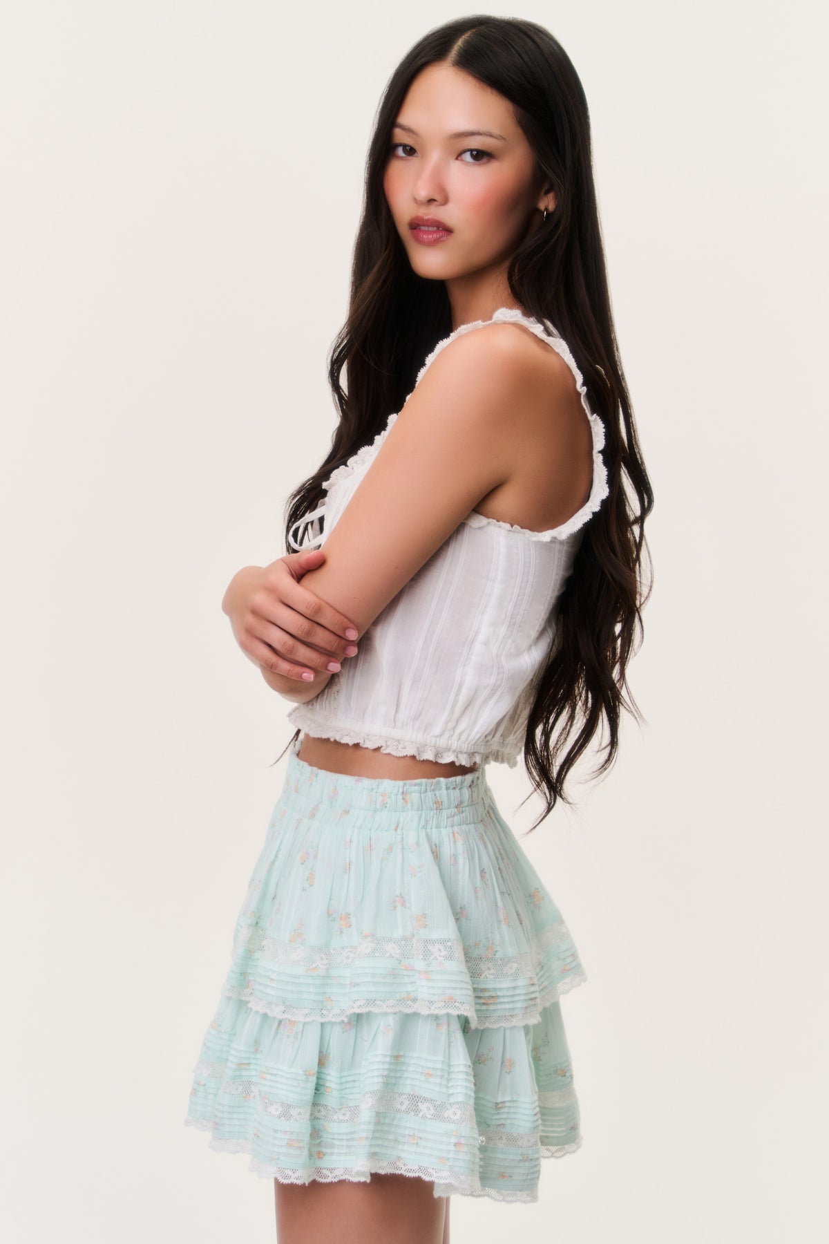 Celadon floral ruffle mini skirt, side view with tiered tiers