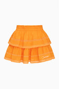 Bright orange tiered ruffle mini skirt with lace trim and “Miami” embroidery