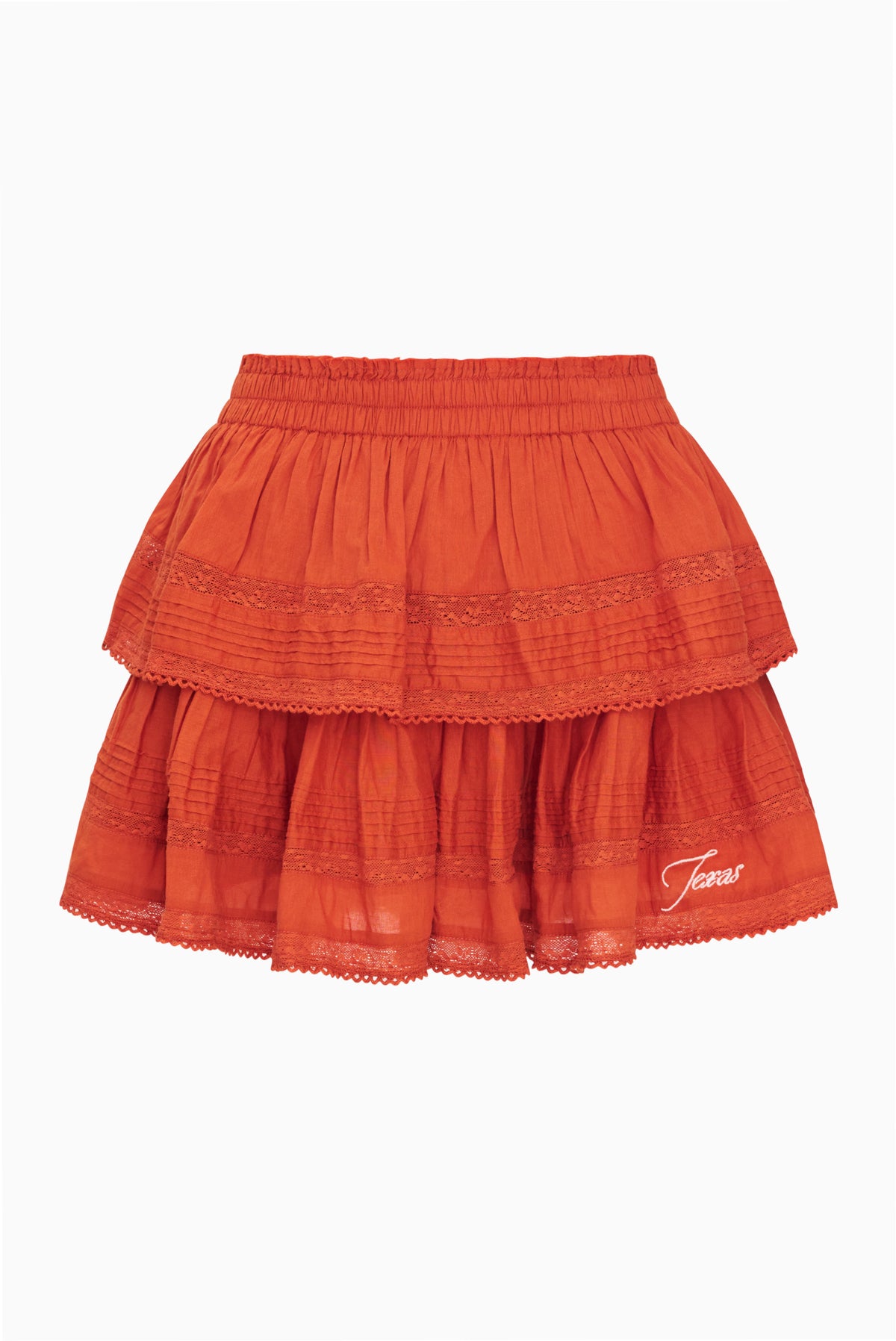Burnt orange ruffle mini skirt with elastic waist and layered skirt tiers.