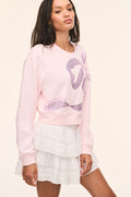 Primrose pink long-sleeve pullover with rhinestone bow front and crew neck