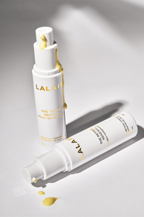 Retinol renewal serum pump bottle with dropper tips and small yellow spills.