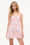 Pink lace mini dress with spaghetti straps, ribbon waist tie, and tiered skirt