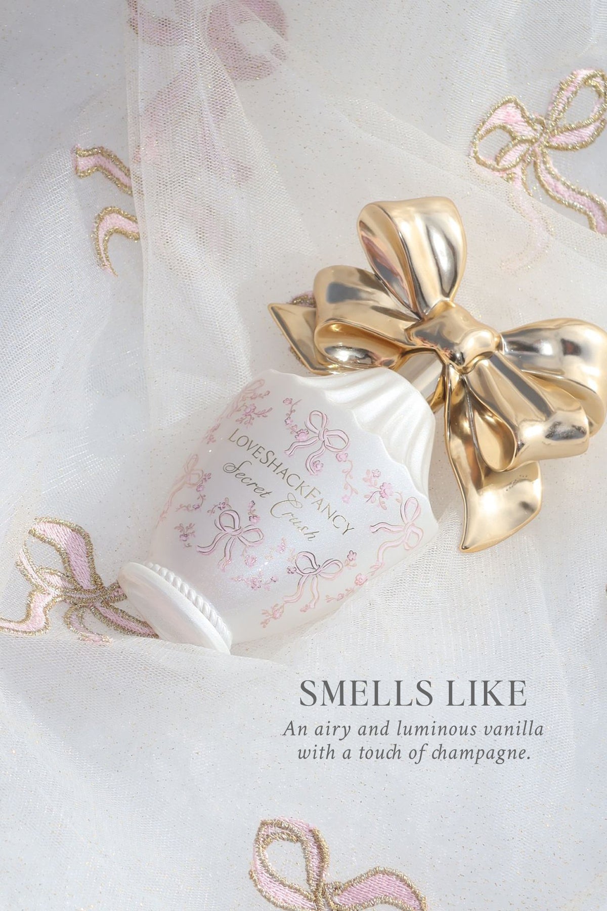Eau de parfum bottle with gold bow on light fabric with quote text overlay