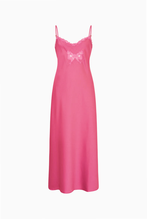 Pink maxi dress with lace trim and bow applique on the front