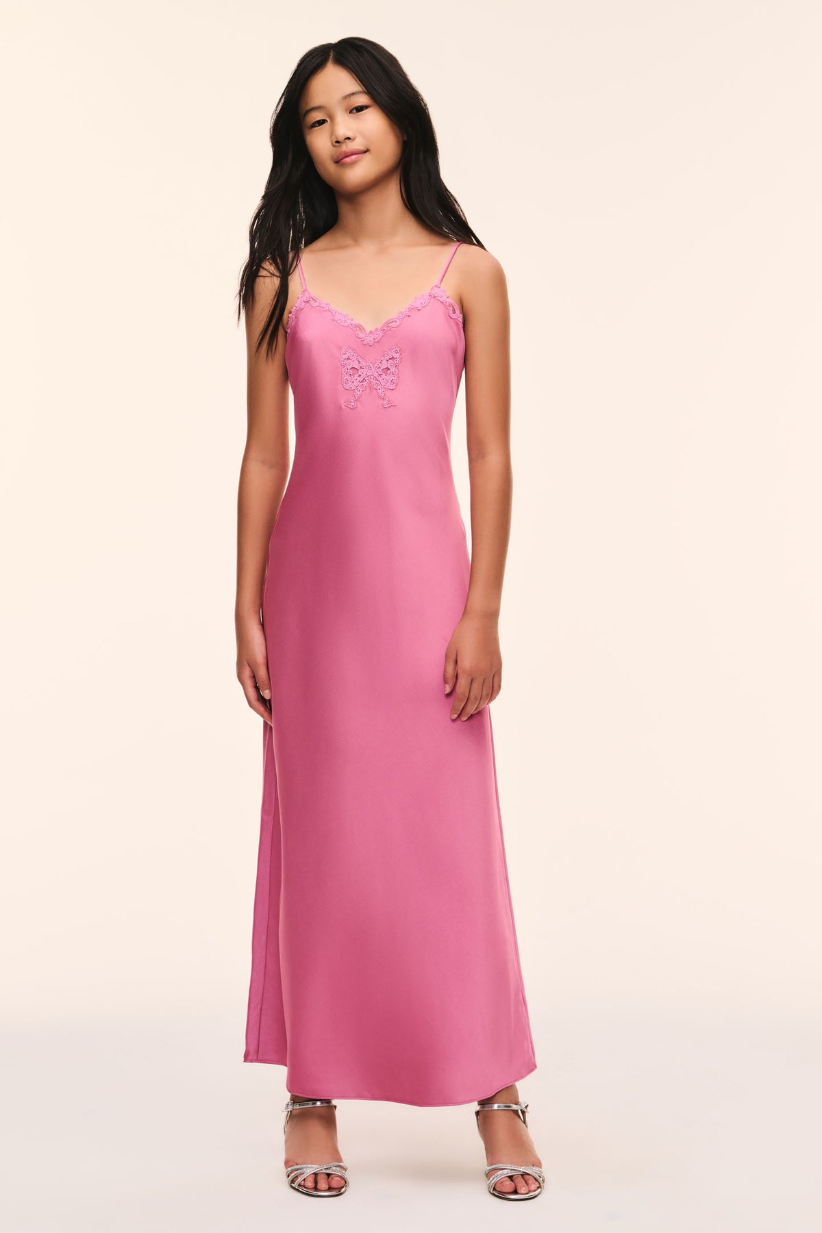 Pink maxi slip dress with lace-trim straps and bow applique detail