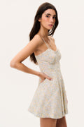 Floral mini dress with thin straps and flared skirt, angled side view