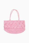 Pink straw tote bag with floral lace crochet top panel and braided handles