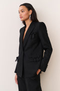 Black wool-blend blazer with bow embellishment at chest and flap pockets