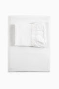 White Victorian sheet and pillowcase set with folded pillowcase