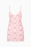 Pink beaded bow mini dress with spaghetti straps, quilted diamond pattern