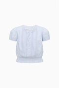 Light blue girls cotton top with short sleeves, button placket, embroidered front and ruffled hem
