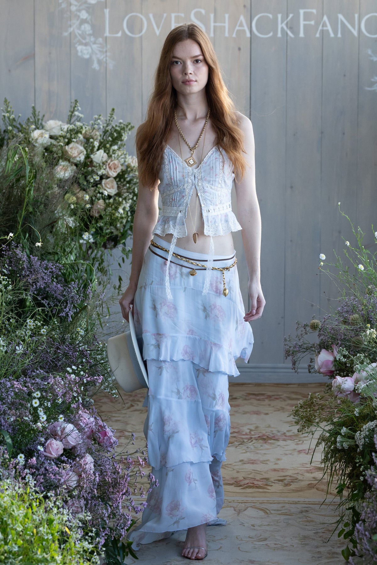Light blue chiffon maxi skirt with pink rose print, tiered ruffles and layered hem