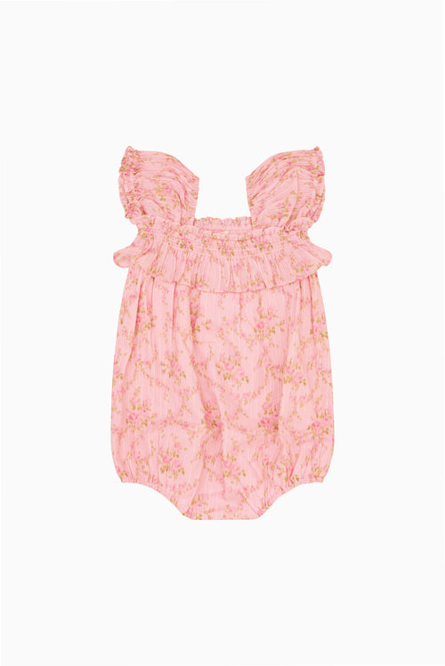 Pink floral baby pinafore with frilled shoulders and gathered skirt front