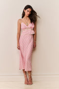 Pink printed midi skirt with elastic waistband and slim straight silhouette