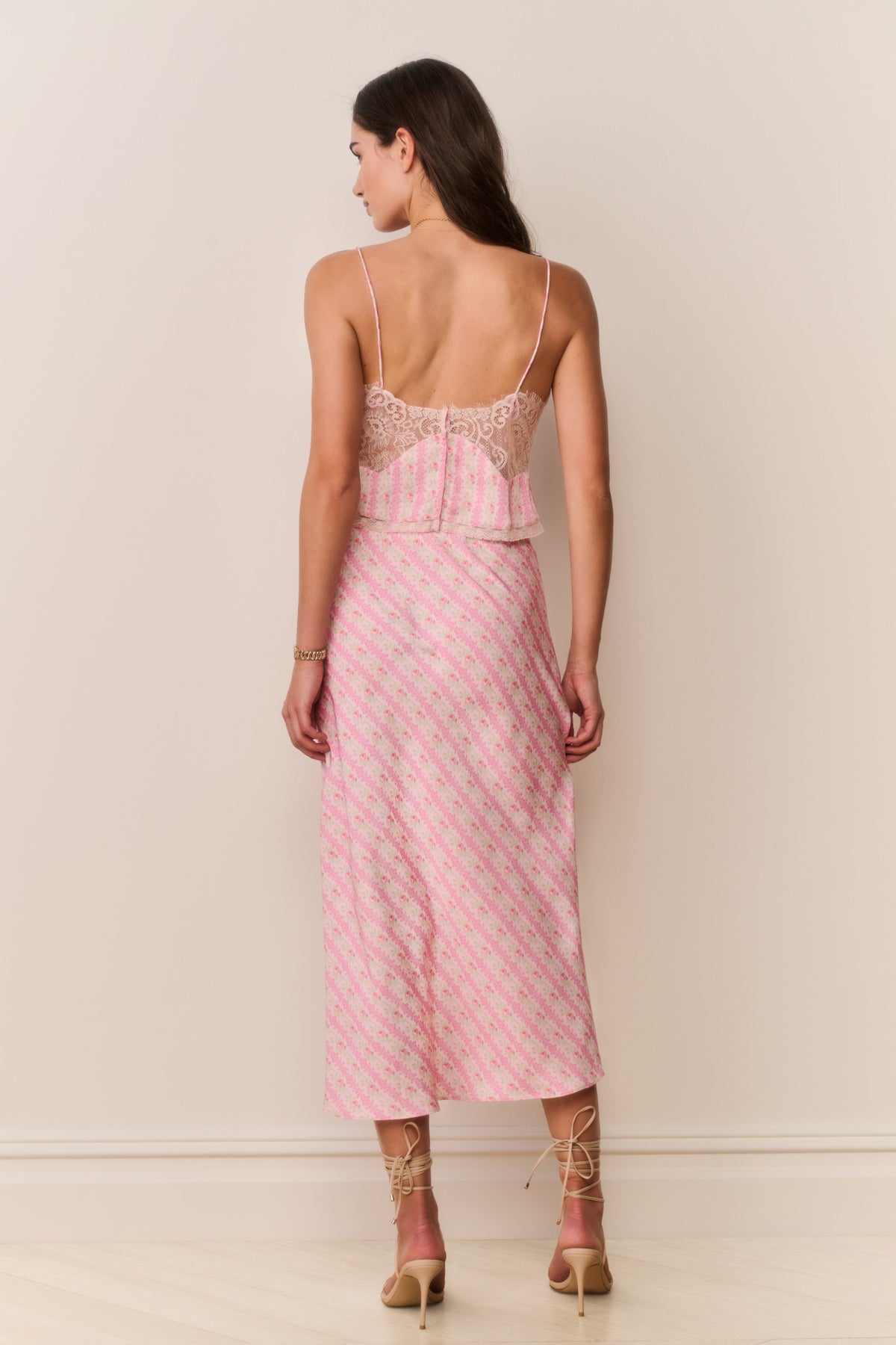 Pink printed midi skirt with wide waistband and visible back seam