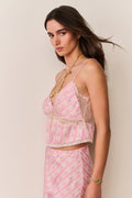 Pink floral cami with lace bust trim and thin straps, fitted waist