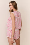 Pink heart-print pajama shorts set with sleeveless top and ruffled shoulders