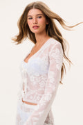 White sheer lace top with V-neck and floral embroidery, long sleeves