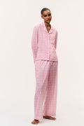 Pink cotton pajama set with button-front shirt and wide-leg pants, small print