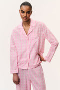 Pink cotton pajama set shirt close-up with pointed collar and small print