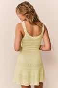 Pointelle knit mini dress back view in pale yellow, racerback with lace trim