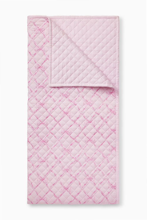 Pink sweetheart quilt with quilted diamond pattern and stitched border